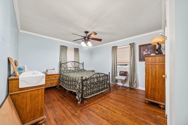 bedroom with crown molding, dark wood-style flooring, baseboards, and ceiling fan