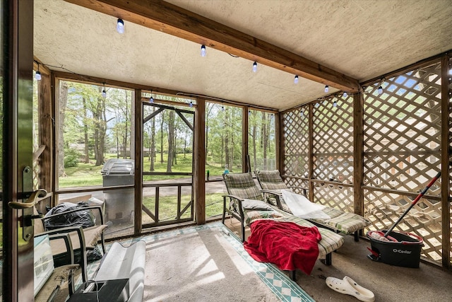 sunroom / solarium with beam ceiling
