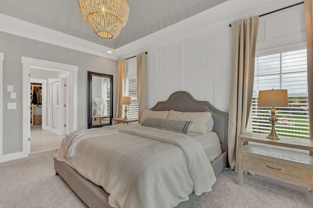 bedroom with an inviting chandelier, carpet floors, baseboards, and multiple windows