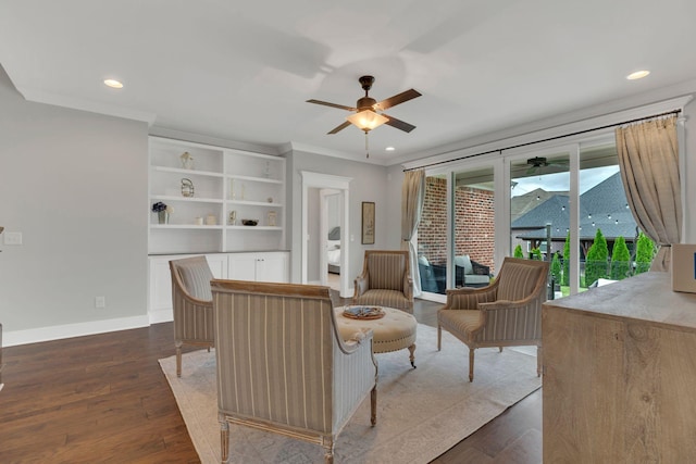 living area featuring crown molding, dark wood finished floors, ceiling fan, and recessed lighting