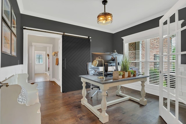 office space with dark wood finished floors and a barn door
