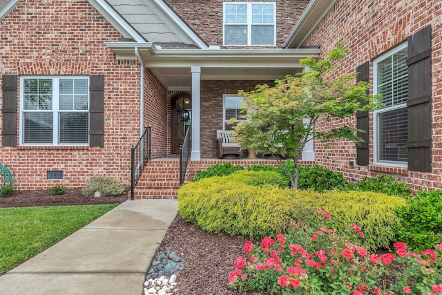 doorway to property with brick siding