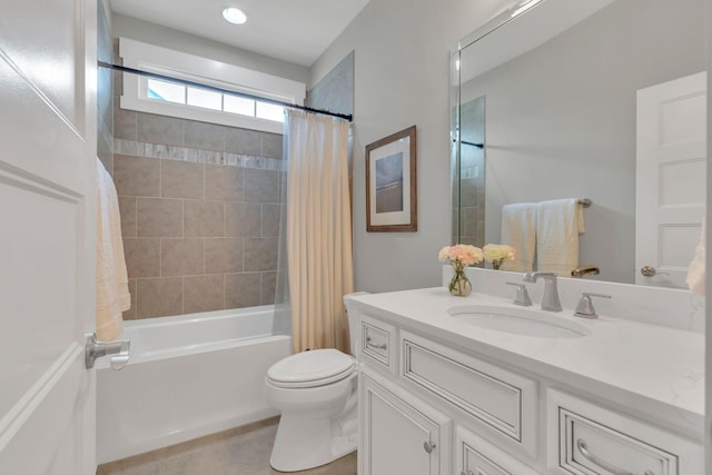 bathroom featuring toilet, tile patterned flooring, vanity, and shower / bath combo with shower curtain