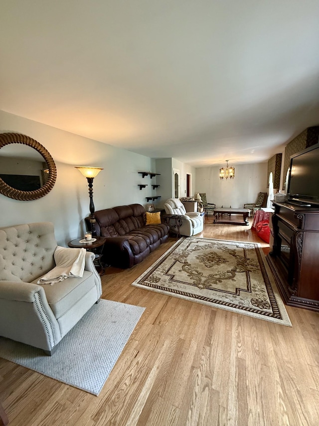 1165 Main St, Lynchburg, TN 37352 - living room with a chandelier and light wood-style floors