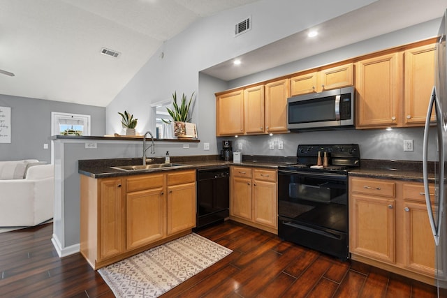 kitchen featuring black appliances, dark wood-style floors, visible vents, and a sink