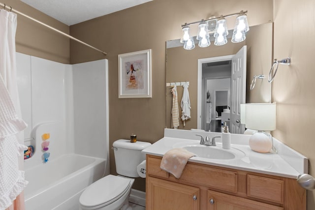 bathroom featuring vanity, toilet, and shower / bath combo with shower curtain