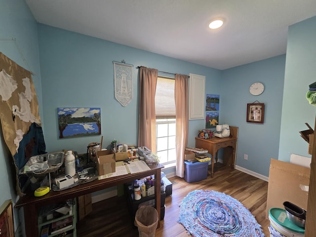 office with baseboards and light wood finished floors