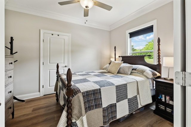 bedroom with crown molding, wood finished floors, baseboards, and ceiling fan