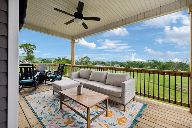 wooden terrace featuring an outdoor hangout area and ceiling fan