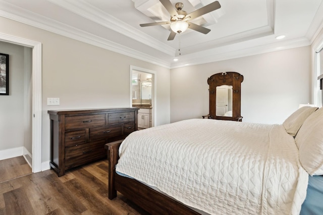 bedroom featuring dark wood-style flooring, a raised ceiling, ornamental molding, and recessed lighting