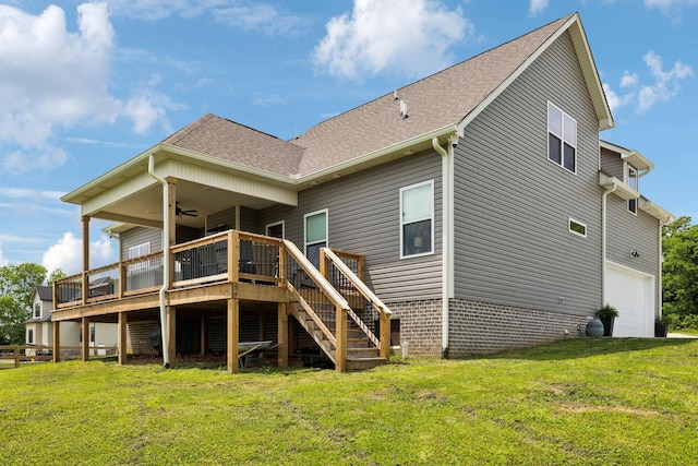 rear view of house featuring stairs, an attached garage, a yard, ceiling fan, and a shingled roof