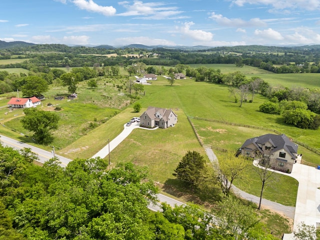 birds eye view of property with a rural view