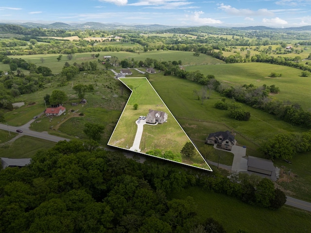 aerial view featuring a rural view and a mountain view