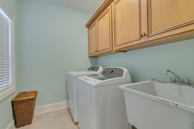 2808 Wynthrope Hall Dr N, Murfreesboro, TN 37129 - laundry room featuring light tile patterned floors, a sink, separate washer and dryer, cabinet space, and baseboards