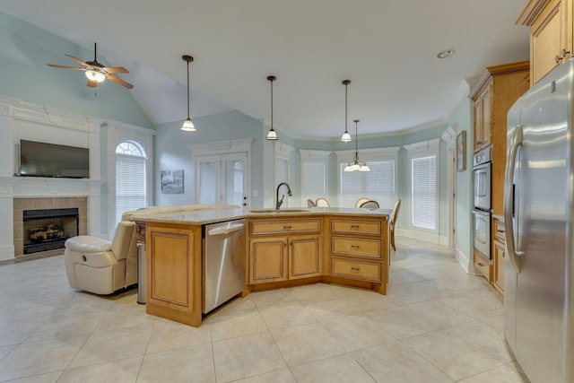 2808 Wynthrope Hall Dr N, Murfreesboro, TN 37129 - kitchen with a sink, appliances with stainless steel finishes, open floor plan, a ceiling fan, and a tile fireplace