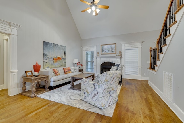 2808 Wynthrope Hall Dr N, Murfreesboro, TN 37129 - living room with wood finished floors, high vaulted ceiling, visible vents, stairway, and ceiling fan