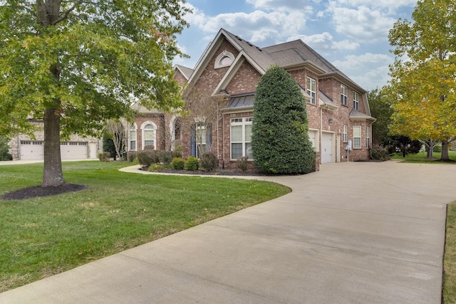 2808 Wynthrope Hall Dr N, Murfreesboro, TN 37129 - view of front of property with driveway, a standing seam roof, brick siding, a garage, and a front lawn