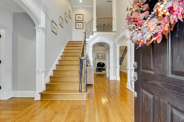 2808 Wynthrope Hall Dr N, Murfreesboro, TN 37129 - entryway with arched walkways, stairs, a high ceiling, and wood finished floors