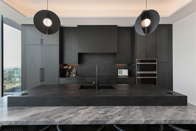 1616 W End Ave Unit 3202, Nashville, TN 37203 - kitchen featuring decorative light fixtures, modern cabinets, a sink, dobule oven black, and dark countertops