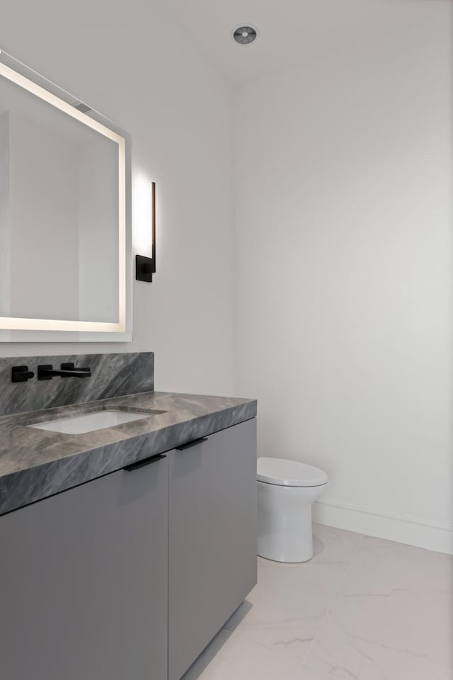 1616 W End Ave Unit 3202, Nashville, TN 37203 - bathroom with vanity, toilet, baseboards, and marble finish floor