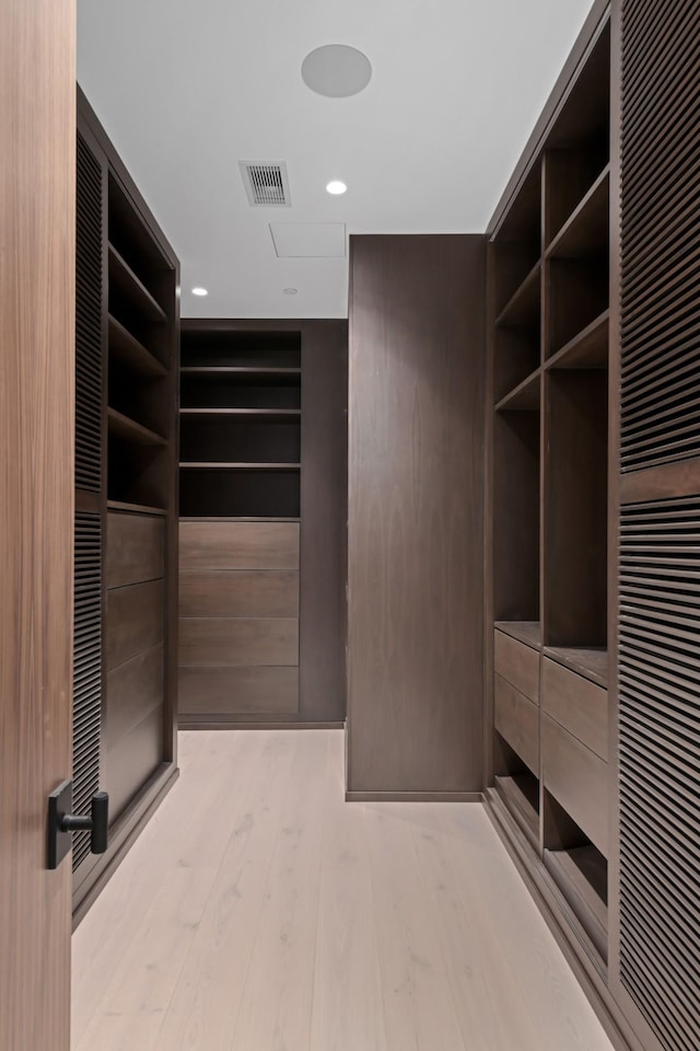1616 W End Ave Unit 3202, Nashville, TN 37203 - walk in closet featuring light wood-style flooring, a heating unit, and visible vents