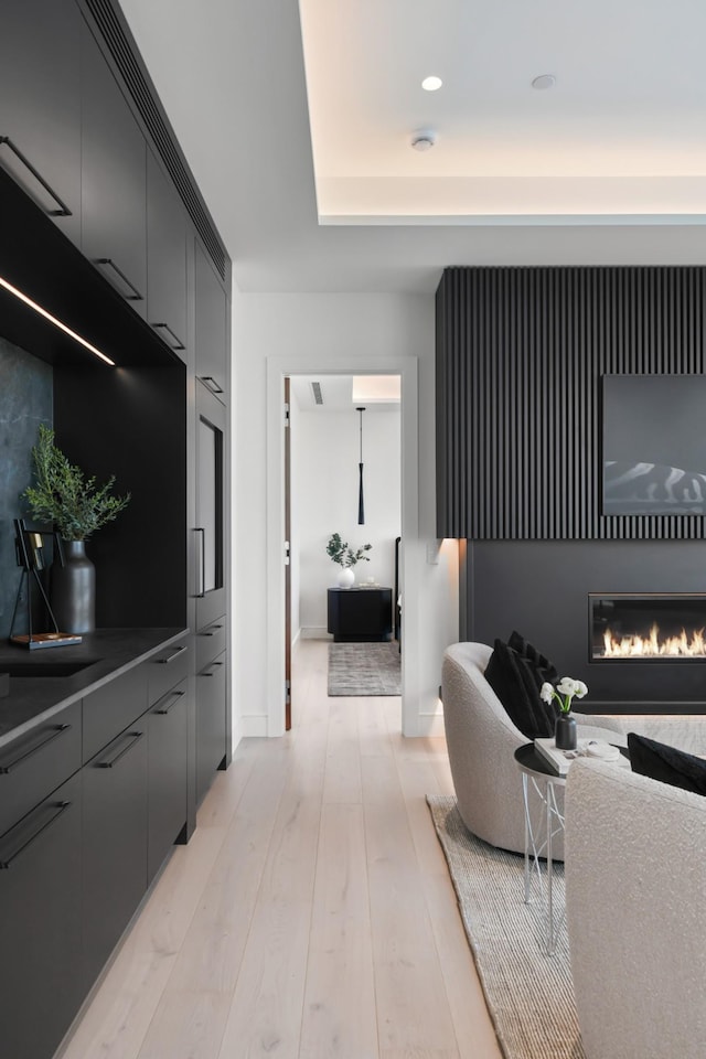 1616 W End Ave Unit 3202, Nashville, TN 37203 - living area featuring light wood finished floors, baseboards, a glass covered fireplace, and recessed lighting
