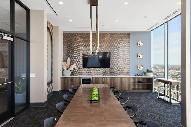 1616 W End Ave Unit 3202, Nashville, TN 37203 - interior space featuring dark colored carpet, plenty of natural light, and floor to ceiling windows