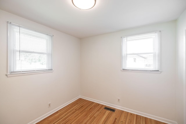 411 Rosehill Ct, Goodlettsville, TN 37072 - spare room with baseboards, a wealth of natural light, light wood-type flooring, and visible vents