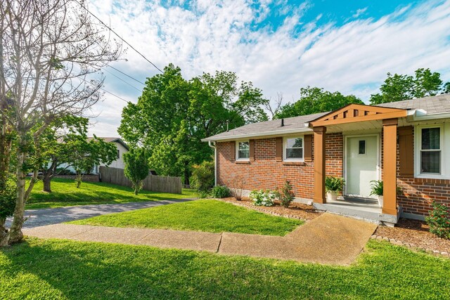 411 Rosehill Ct, Goodlettsville, TN 37072 - view of front of property featuring fence, brick siding, and a front yard