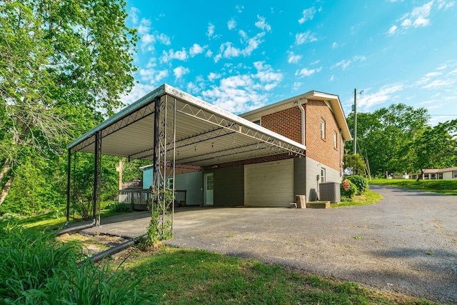411 Rosehill Ct, Goodlettsville, TN 37072 - exterior space with central AC unit, aphalt driveway, and an attached carport