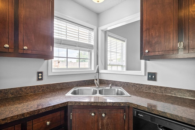 1476 Mutual Dr, Clarksville, TN 37042 - kitchen with dishwasher, dark countertops, and dark brown cabinets