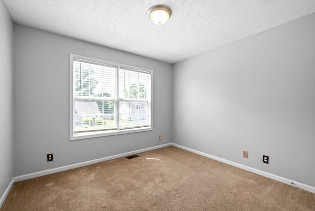 1476 Mutual Dr, Clarksville, TN 37042 - carpeted spare room with a textured ceiling and baseboards