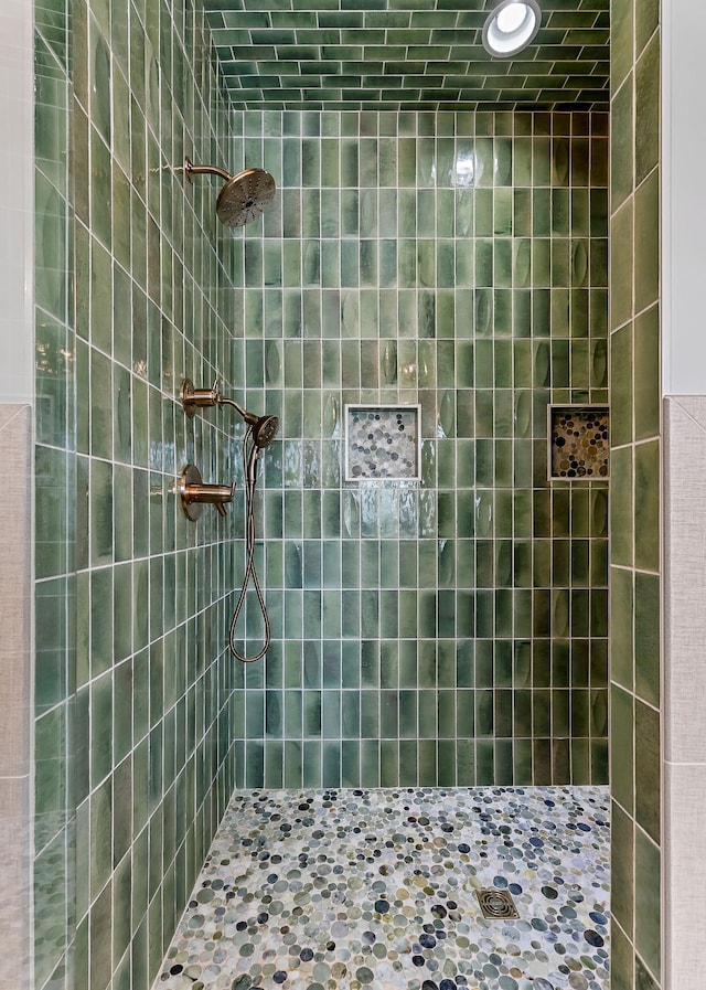 full bathroom with tiled shower