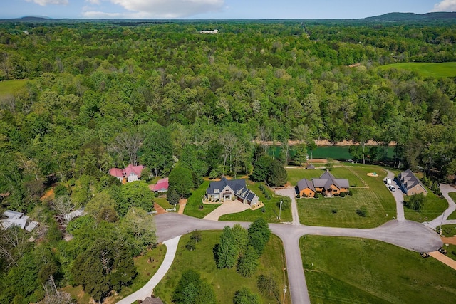 drone / aerial view with a forest view