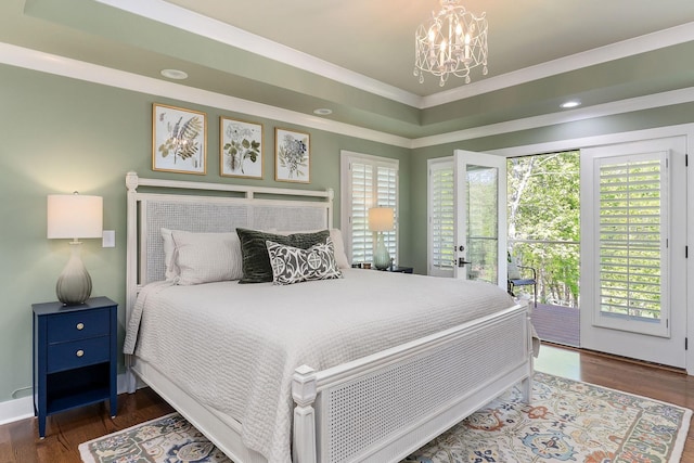 bedroom featuring recessed lighting, an inviting chandelier, access to outside, crown molding, and wood finished floors