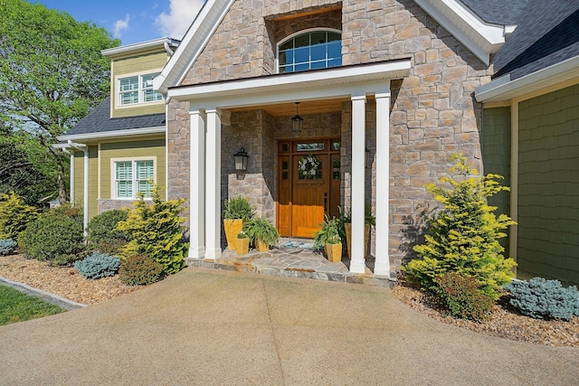 entrance to property featuring stone siding
