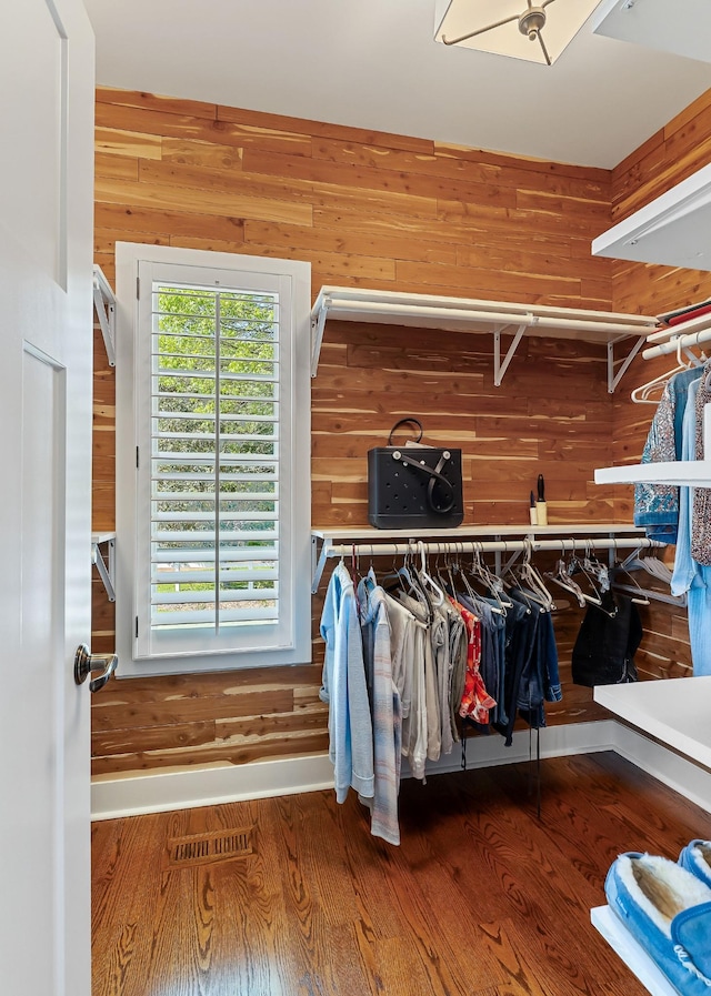 spacious closet featuring visible vents and wood finished floors