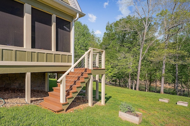 view of yard featuring stairs and a sunroom
