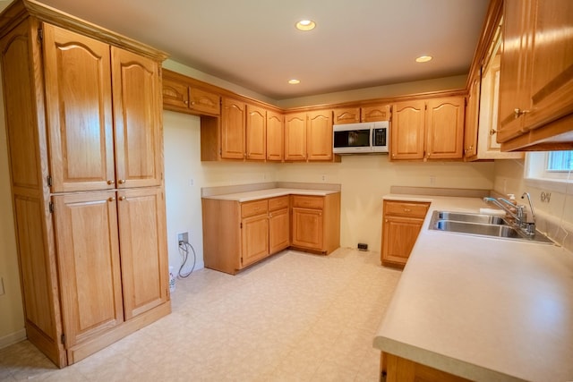1876 Fall River Rd, Lawrenceburg, TN 38464 - kitchen with a sink, light flooring, recessed lighting, light countertops, and brown cabinets