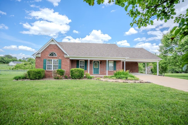 1876 Fall River Rd, Lawrenceburg, TN 38464 - view of front of house with brick siding, concrete driveway, an attached carport, and a shingled roof