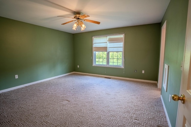 1876 Fall River Rd, Lawrenceburg, TN 38464 - carpeted spare room with baseboards and a ceiling fan