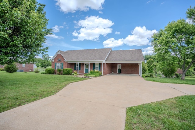 1876 Fall River Rd, Lawrenceburg, TN 38464 - view of front of home featuring concrete driveway, brick siding, a front lawn, a carport, and roof with shingles