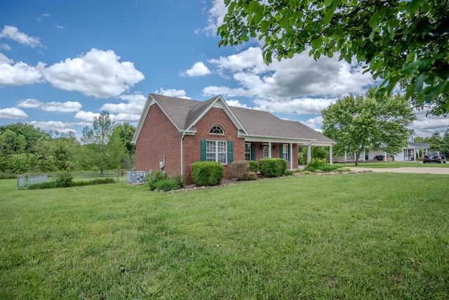 1876 Fall River Rd, Lawrenceburg, TN 38464 - view of front of property featuring brick siding, central AC, and a shingled roof