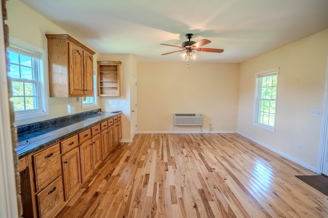 1876 Fall River Rd, Lawrenceburg, TN 38464 - kitchen featuring open shelves, light wood-type flooring, brown cabinetry, a ceiling fan, and baseboards