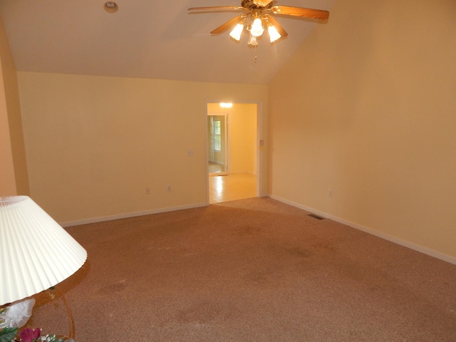 1876 Fall River Rd, Lawrenceburg, TN 38464 - empty room featuring light colored carpet, vaulted ceiling, a ceiling fan, and baseboards
