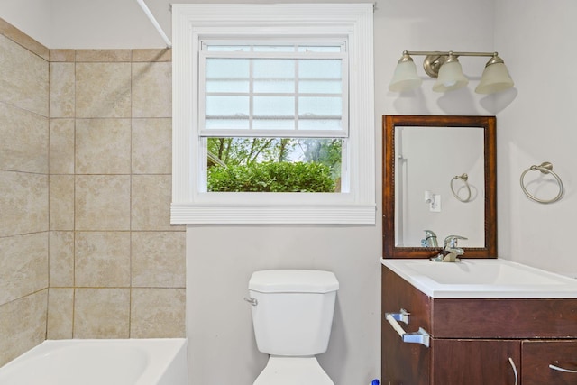 bathroom featuring toilet, vanity, and washtub / shower combination