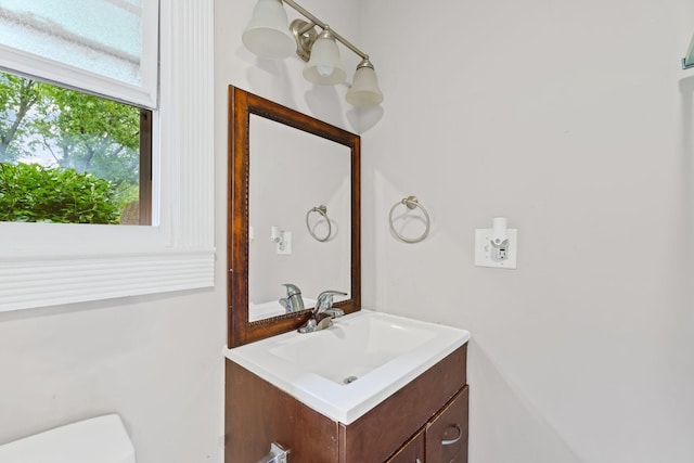 half bath with toilet and vanity