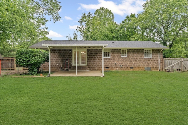 back of house with a yard, a patio area, crawl space, and fence private yard