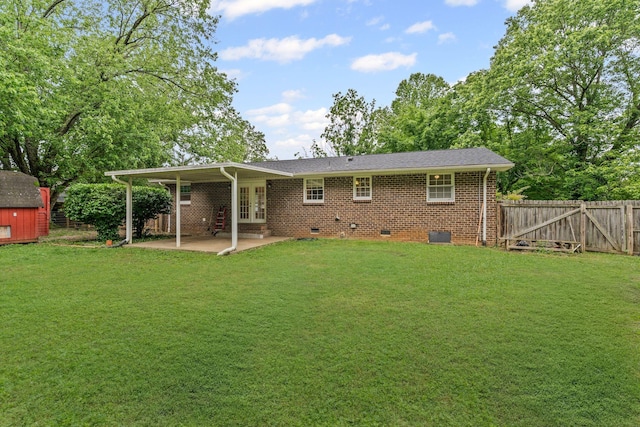 rear view of property with a lawn, a patio, french doors, and crawl space