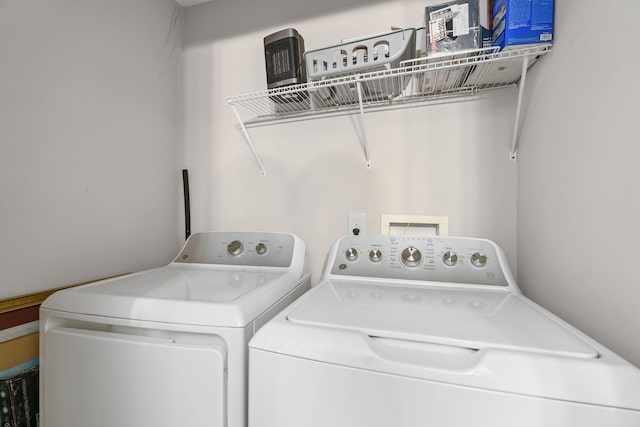 clothes washing area featuring washer and dryer